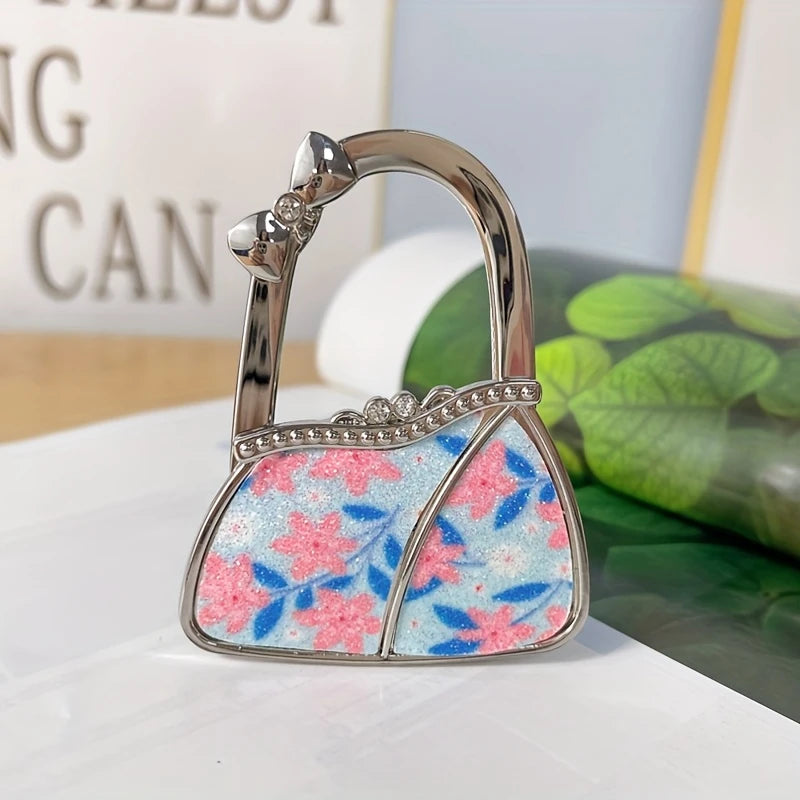 Cuelga Bolsos Plegable para Mesa – "Gema de Hi'ilawe" 👜✨💎
