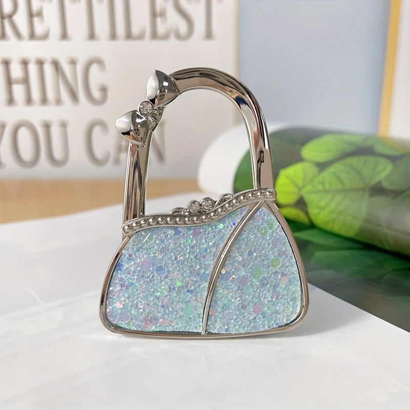 Cuelga Bolsos Plegable para Mesa – "Gema de Hi'ilawe" 👜✨💎
